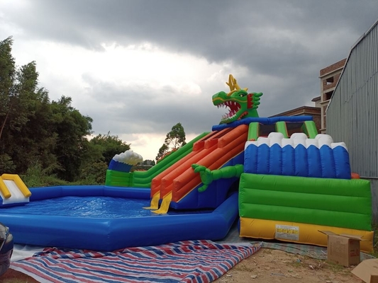 0.9mm PVC Mobile Land Ground Inflatable Water Park Dengan Pool Slide Commercial