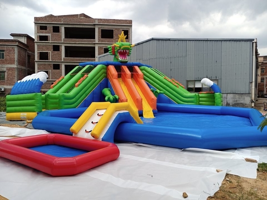 0.9mm PVC Mobile Land Ground Inflatable Water Park Dengan Pool Slide Commercial