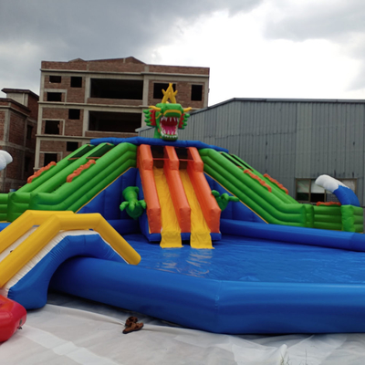 0.9mm PVC Mobile Land Ground Inflatable Water Park Dengan Pool Slide Commercial