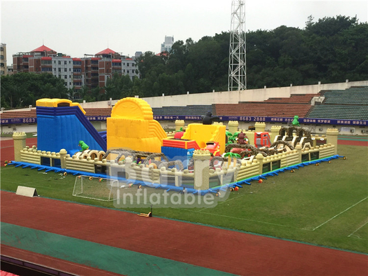 1600m2 taman hiburan inflatable terbesar di dunia Indoor Dinosaurs Outdoor Big Bounce Dengan Game Olahraga